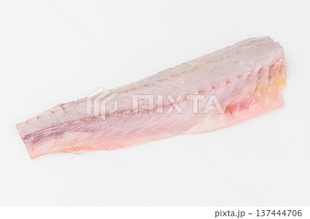 Raw sea bass fillet isolated on white background, fresh Mediterranean seafood ingredient with natural texture and clean minimal studio composition. Raw sea bass fillet isolated on white background, fresh Mediterranean seafood ingredient with natural texture and clean minimal studio composition. 137444706