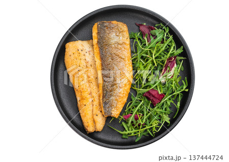 Pan fried sea bass fillets served on black plate with fresh arugula salad, gourmet seafood meal on isolated background with copy space. Pan fried sea bass fillets served on black plate with fresh arugula salad, gourmet seafood meal on isolated background with copy space. 137444724