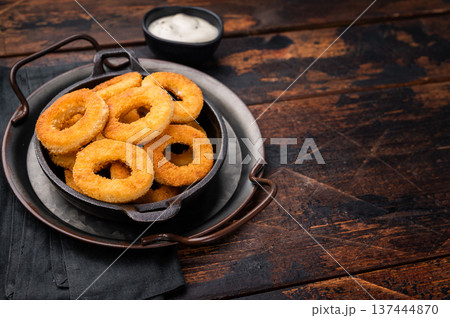Crispy Fried squid rings, calamari fastfood snack. wooden background. top view 137444870