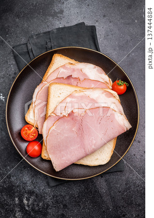 Ham sandwich, toast with sliced Prosciutto Cotto. black background. top view 137444884
