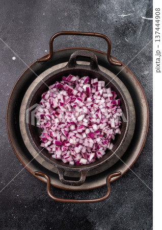 Chopped Red onion slices in steel tray. black background. top view Chopped Red onion slices in steel tray. black background. top view 137444908
