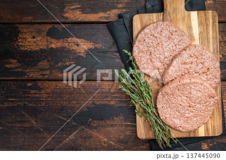 Vegan meatless burger patties plant based protein substitute for vegetarian and flexitarian diet dark background top view 137445090