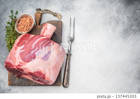 Fresh raw beef shank knuckle whole cut with bone styled with thyme and salt copy space on stone background ingredient for ossobuco Fresh raw beef shank knuckle whole cut with bone styled with thyme and salt copy space on stone background ingredient for ossobuco 137445203