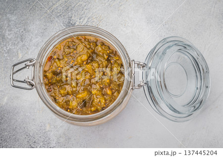 Traditional green pickle relish stored in glass jar on rustic wooden board top view food background with copy space Traditional green pickle relish stored in glass jar on rustic wooden board top view food background with copy space 137445204