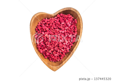 Freeze dried raspberry granules in wooden bowl isolated on white background. Natural vibrant berry texture flatlay Freeze dried raspberry granules in wooden bowl isolated on white background. Natural vibrant berry texture flatlay 137445320