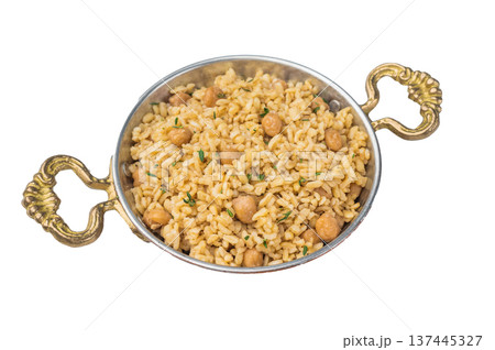 Turkish bulgur pilaf with chickpeas served in metal bowl on wooden board top view rustic isolated background with copy space 137445327