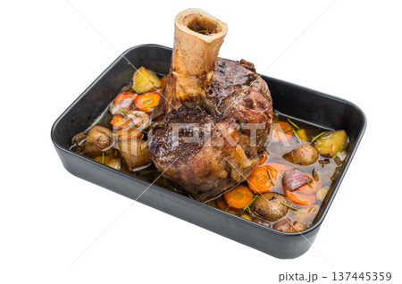 Slow cooked veal shank ossobuco style roasted with vegetables and gravy in baking tray on light background Slow cooked veal shank ossobuco style roasted with vegetables and gravy in baking tray on light background 137445359