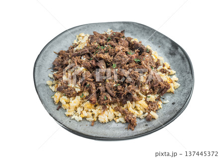 Anatolian kavurma over grains displaying diced and shredded textures, caramelized edges, collagen rendered meat and rustic culinary styling. Anatolian kavurma over grains displaying diced and shredded textures, caramelized edges, collagen rendered meat and rustic culinary styling. 137445372