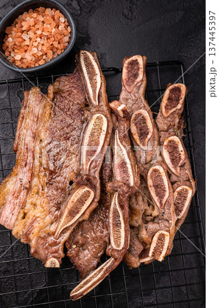Top view of Korean BBQ Kalbi on a cooling rack. Dark food photography, ready to serve, perfect for restaurant menus. 137445397