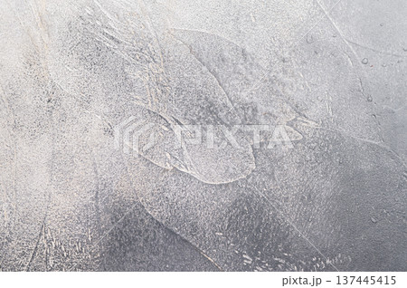 Rough cement surface with natural strokes ideal for culinary mockups and stylish tabletop food photo backgrounds. 137445415