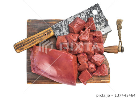 Raw beef liver whole and cubed on wooden board with cleaver. Fresh organ meat 137445464
