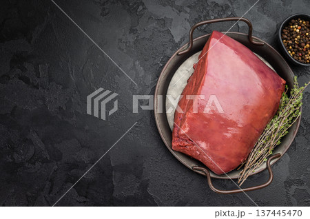 Uncooked beef liver served in cast iron dish. Fresh organ meat ingredient referred as veal calf liver. 137445470