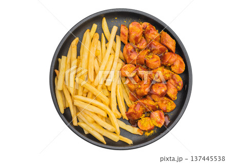 Currywurst Hot sausage with curry ketchup and golden fries on black dish suitable for fast food ads takeaway visuals and premium stock imagery. Currywurst Hot sausage with curry ketchup and golden fries on black dish suitable for fast food ads takeaway visuals and premium stock imagery. 137445538