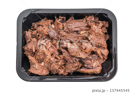 Stewed venison elk meat in a black container on white background, tender braised wild game ready meal rich in flavor and protein. Stewed venison elk meat in a black container on white background, tender braised wild game ready meal rich in flavor and protein. 137445545