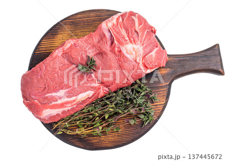 Vibrant raw horse meat on a rustic wooden surface, highlighting its rich color and fine marbling, ideal for unique culinary dishes. isolated on white background. top view 137445672