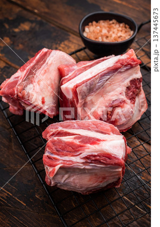 Thick Cut raw lamb Short Ribs, fresh mutton meat with bone. wooden background. top view 137445673