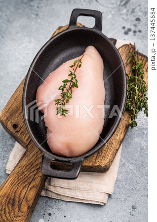 Raw white meat cuts, showcasing their natural shape and quality. A staple ingredient for countless delicious dishes in any kitchen. grey background. top view 137445684