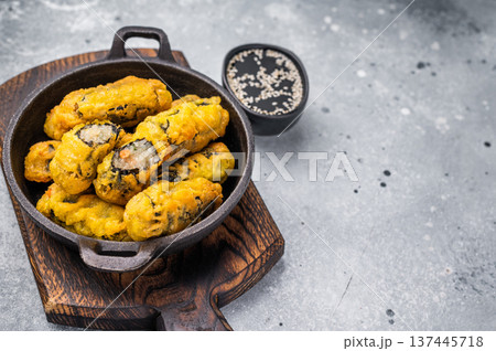 Korean Crispy seaweed noodle rolls Gimmari deep-fried seaweed rice rolls. grey background. top view Korean Crispy seaweed noodle rolls Gimmari deep-fried seaweed rice rolls. grey background. top view 137445718
