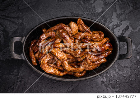 Korean Beef Meat Bulgogi Hot Plate. black background. top view 137445777