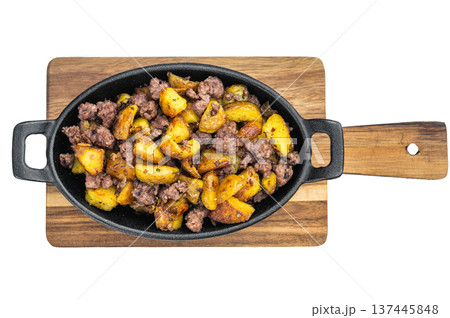 lassic beef hash with golden diced potatoes in a black cast iron pan on bright background ideal for hearty meal imagery. lassic beef hash with golden diced potatoes in a black cast iron pan on bright background ideal for hearty meal imagery. 137445848