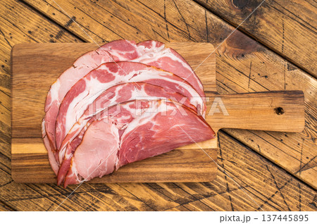 Traditional German schinken meat served with thyme and garlic on aged wood ideal for culinary photography. Traditional German schinken meat served with thyme and garlic on aged wood ideal for culinary photography. 137445895