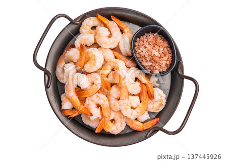 A tray of shrimp is served with a black bowl of salt. isolated on white background 137445926