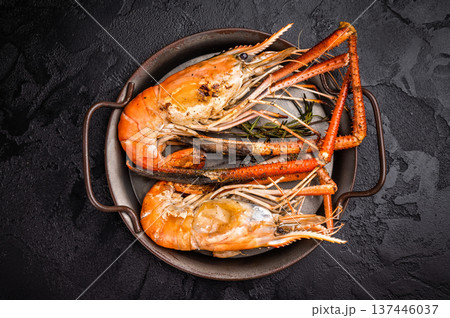 Succulent grilled rosenbergii prawn shrimp, perfectly charred and bursting with flavor, ideal for seafood lovers. black background. top view 137446037