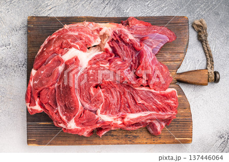 Fresh raw beef neck meat, perfect for slow cooking and creating rich, flavorful stews and hearty dishes. white background. top view Fresh raw beef neck meat, perfect for slow cooking and creating rich, flavorful stews and hearty dishes. white background. top view 137446064