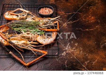 Savory grilled rosenbergii prawn drizzled with garlic butter, a luxurious treat for any seafood enthusiast. brown background. top view Savory grilled rosenbergii prawn drizzled with garlic butter, a luxurious treat for any seafood enthusiast. brown background. top view 137446068