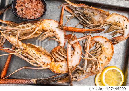 Deliciously grilled giant river prawns on steel tray, ideal for summer gatherings and outdoor feasts. white background. top view 137446090