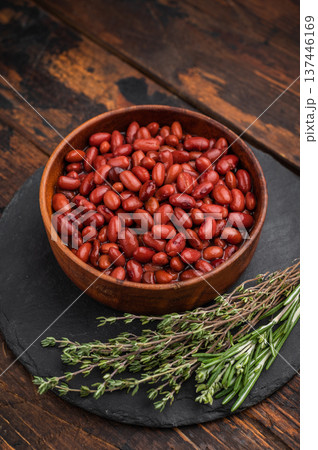 Simple, wholesome portion of kidney beans in a rustic wooden dish. Ideal for diet, vegetable, and vegan recipe blogs. 137446169