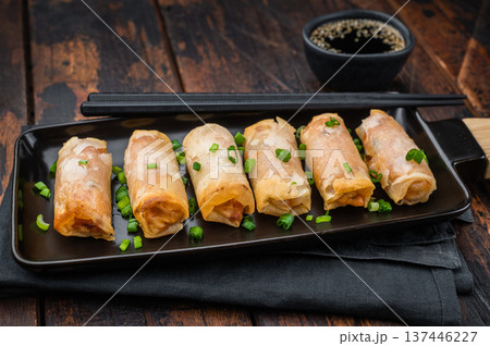 Fried spring rolls Lumpia crunchy appetizer with soy sauce and scallions minimal Asian food concept 137446227