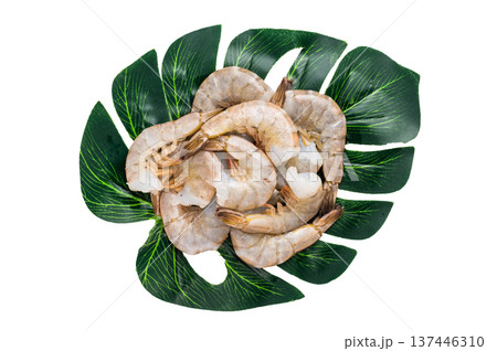 Raw headless white shrimps prawns isolated on white background. Raw headless white shrimps prawns isolated on white background. 137446310