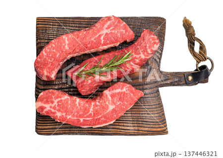 Raw marbled beef Steak, beef meat on wooden board with herbs isolated on white background 137446321
