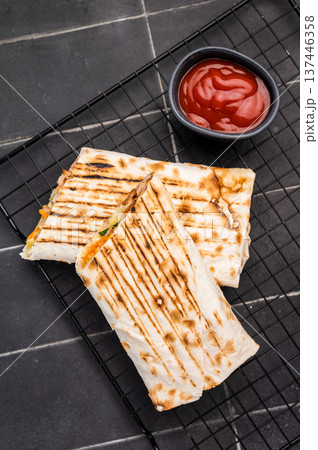 Turkish Shawarma, doner wrap sandwich with meat and salad. black background. top view 137446358