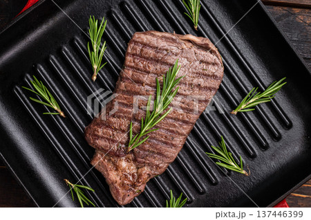 Grilled beef Top sirloin steak or Rump steak in grill pan. wooden background. top view Grilled beef Top sirloin steak or Rump steak in grill pan. wooden background. top view 137446399