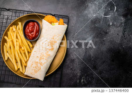 Doner kebab with shrimps, prawns, salad and french fry. black background. top view 137446400