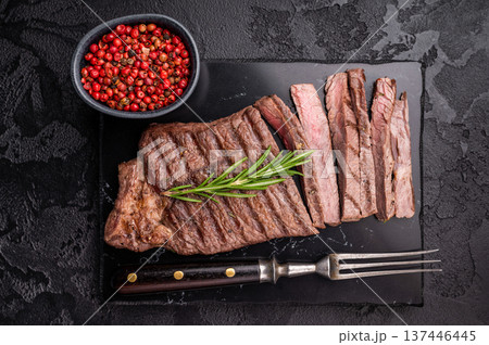 Grilled medium beef Rump steak on marble board. black background. top view 137446445