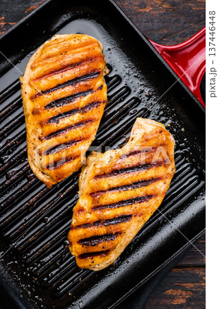 Roasted on grill pan Chicken breasts, fried poultry meat steaks, top view, wooden background. 137446448