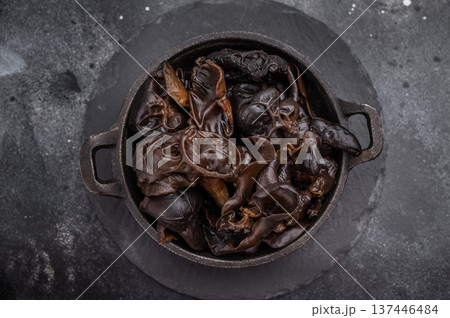 A bowl of fresh wood ear mushrooms, perfect for health conscious cooks seeking nutritious and flavorful ingredient. black background. top view A bowl of fresh wood ear mushrooms, perfect for health conscious cooks seeking nutritious and flavorful ingredient. black background. top view 137446484