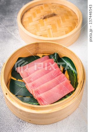Artful presentation of fresh tuna sashimi, a deliciously healthy choice that delights the senses and pleases the palate. white background. top view Artful presentation of fresh tuna sashimi, a deliciously healthy choice that delights the senses and pleases the palate. white background. top view 137446543