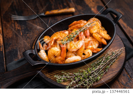 Deliciously seasoned grilled shrimp prawns with vibrant colors, a must-have for seafood lovers and culinary enthusiasts. wooden background. top view 137446561