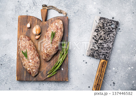 Succulent raw kofta kebab pieces marinated in spices, ideal for grilling enthusiasts looking to elevate their barbecue game. grey background. top view 137446582