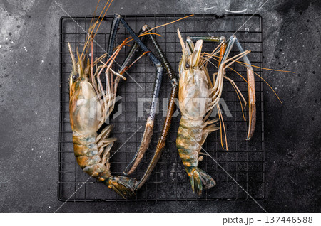 Fresh raw rosenbergii shrimp prawn, perfect for gourmet dishes and seafood lovers seeking premium quality.black background. top view 137446588
