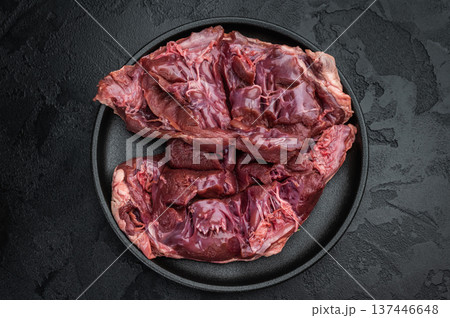 Raw veal hearts prepared for cooking highlighting tender texture great for slow braising frying and gourmet broths. 137446648