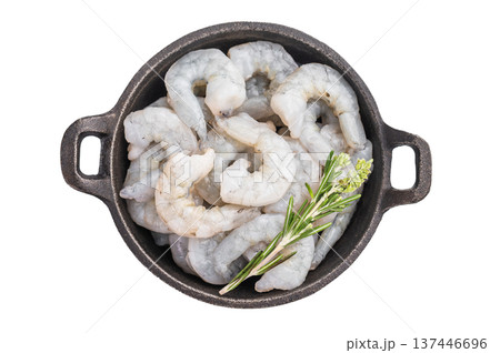 Uncooked prawns shrimps in a skillet ready for a healthy meal. Top view of seafood with herbs on a white background. Uncooked prawns shrimps in a skillet ready for a healthy meal. Top view of seafood with herbs on a white background. 137446696