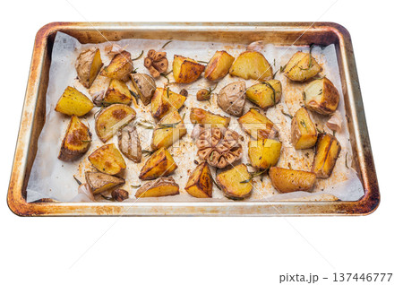Golden roasted potato wedges with herbs and garlic. Homemade comfort food side dish cooked in oven Golden roasted potato wedges with herbs and garlic. Homemade comfort food side dish cooked in oven 137446777