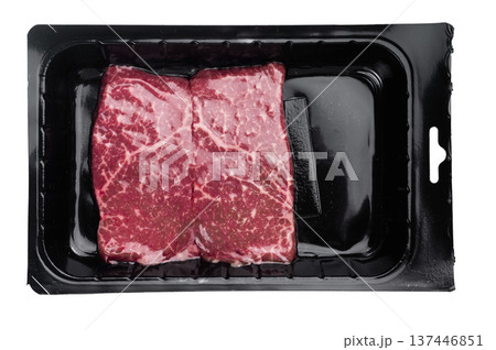 Raw wagyu beef top side top round with rich marbling packed in black plastic tray. Isolated on white background retail meat concept. Raw wagyu beef top side top round with rich marbling packed in black plastic tray. Isolated on white background retail meat concept. 137446851