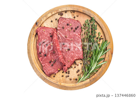 Fresh raw beef steak flatiron cut with herbs and spices on rustic wooden board overhead view isolated background Fresh raw beef steak flatiron cut with herbs and spices on rustic wooden board overhead view isolated background 137446860