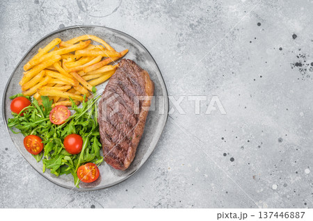 Juicy grilled beef culotte steak with potatoes and arugula salad, sirloin cap cut served for lunch or dinner Juicy grilled beef culotte steak with potatoes and arugula salad, sirloin cap cut served for lunch or dinner 137446887
